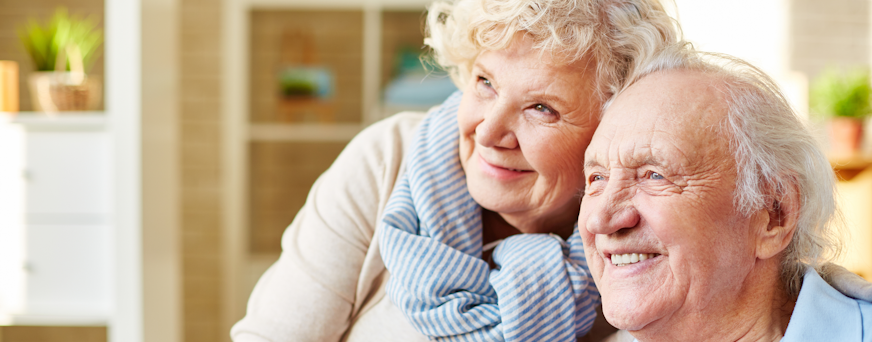 Life Assure Seniors Couple Sitting Together At Home Hero